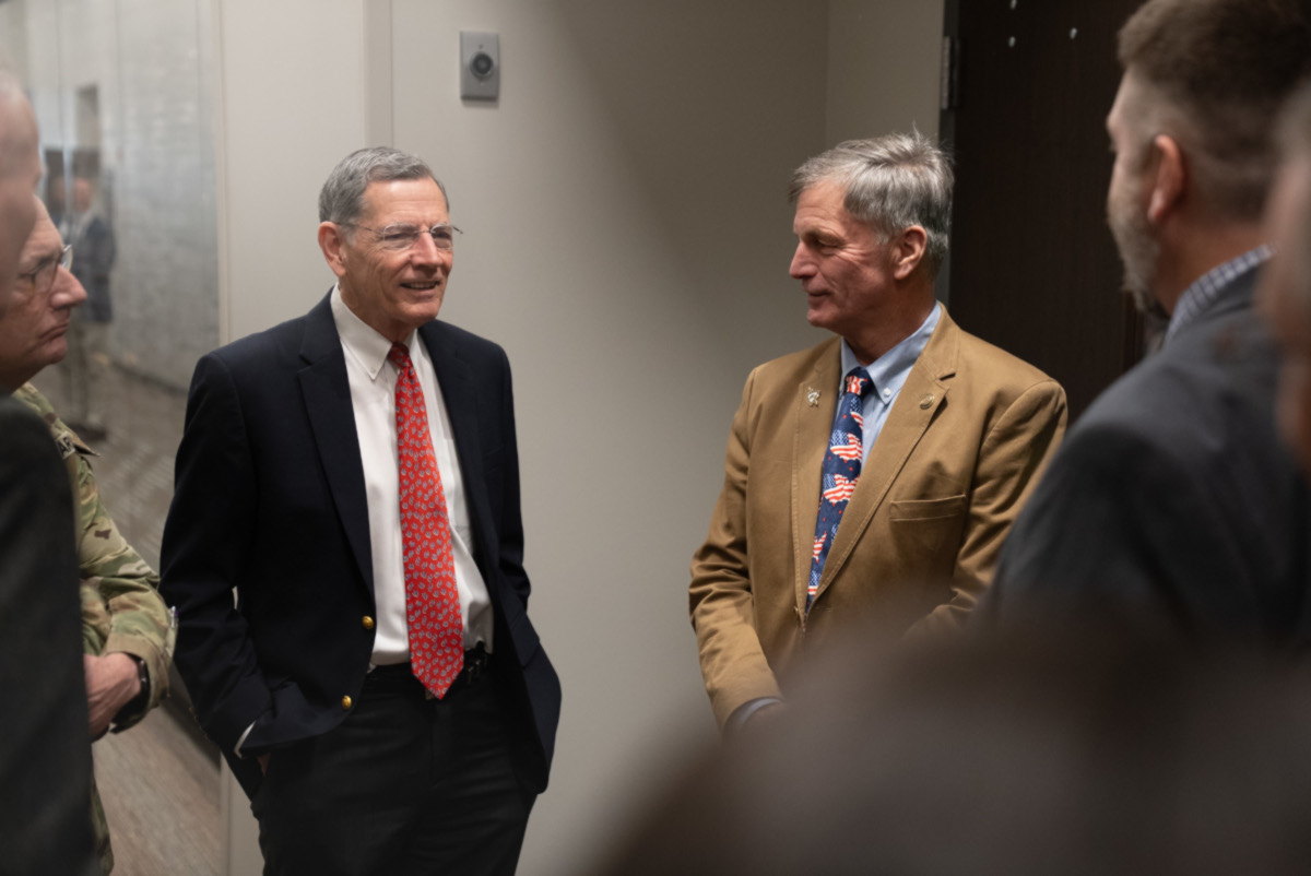 U.S. Sen. John Barrasso, left, visits with Wyoming Gov. Mark Gordon and veterans during a Vietnam Veterans Day event on March 28, 2026, at the National Museum of Military Vehicles in Dubois, Wyo.