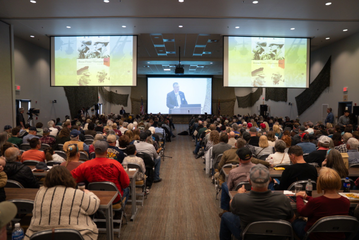 A near-capacity crowd watches the Wyoming PBS documentary “Home From the Vietnam War,” directed by Mat Hames, during a Vietnam Veterans Day event on March 28, 2026, at the National Museum of Military Vehicles in Dubois, Wyo. The film tells the story of U.S. Army Lt. Lee Alley, Wyoming’s most decorated veteran, from his service in Vietnam to his work supporting fellow veterans. (Photo: WyomingPBS)